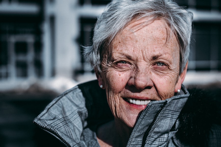A smiling older lady with silver hair