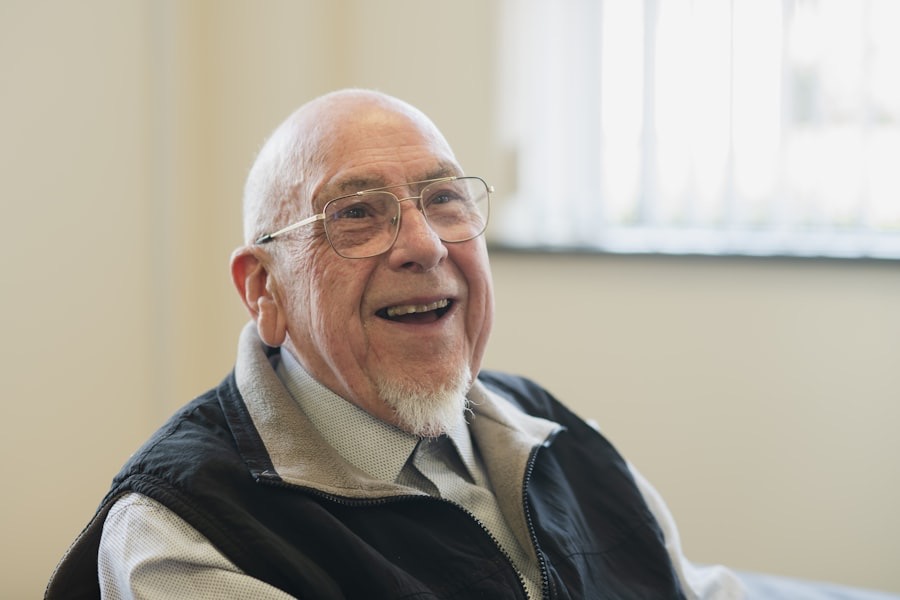 A laughing older man with glasses