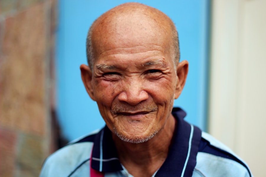 A smiling older man with his mug taking his check-in call